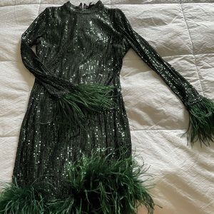 Green sequin dress with feathers